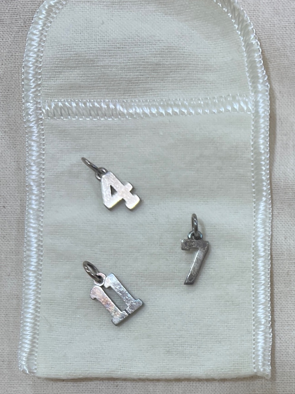 James Avery 
Silver Number 4, 7, 11 Charms